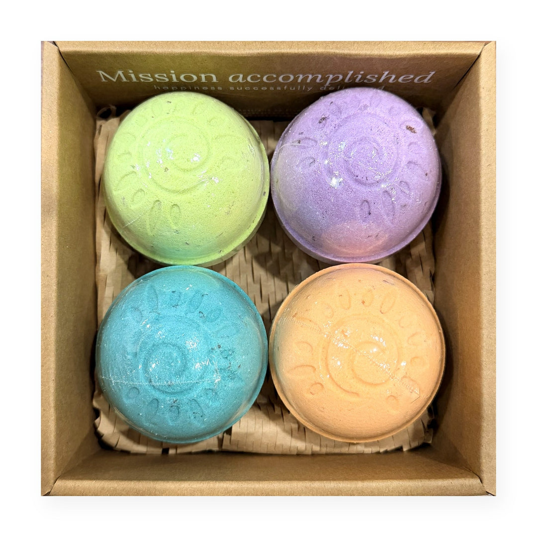 Aromatherapy bath bomb gift box opened to show four butter bombs: Nighty Night, Keep Calm, Hippie Smoke and Serenity