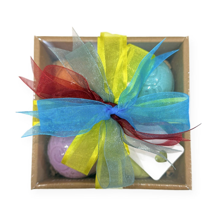 Bath bomb gift set with yellow, blue and red ribbon and a gift card, ready to give