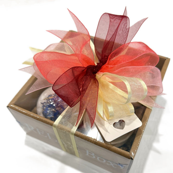 Botanical Bath Bomb Gift Box wrapped with a red organza ribbon bow and heart gift tag