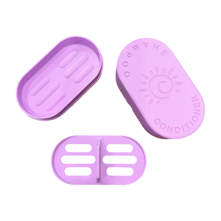 Lilac Shampoo and Conditioner Bar Travel Case shown open with the sun embossed lid, base and draining insert